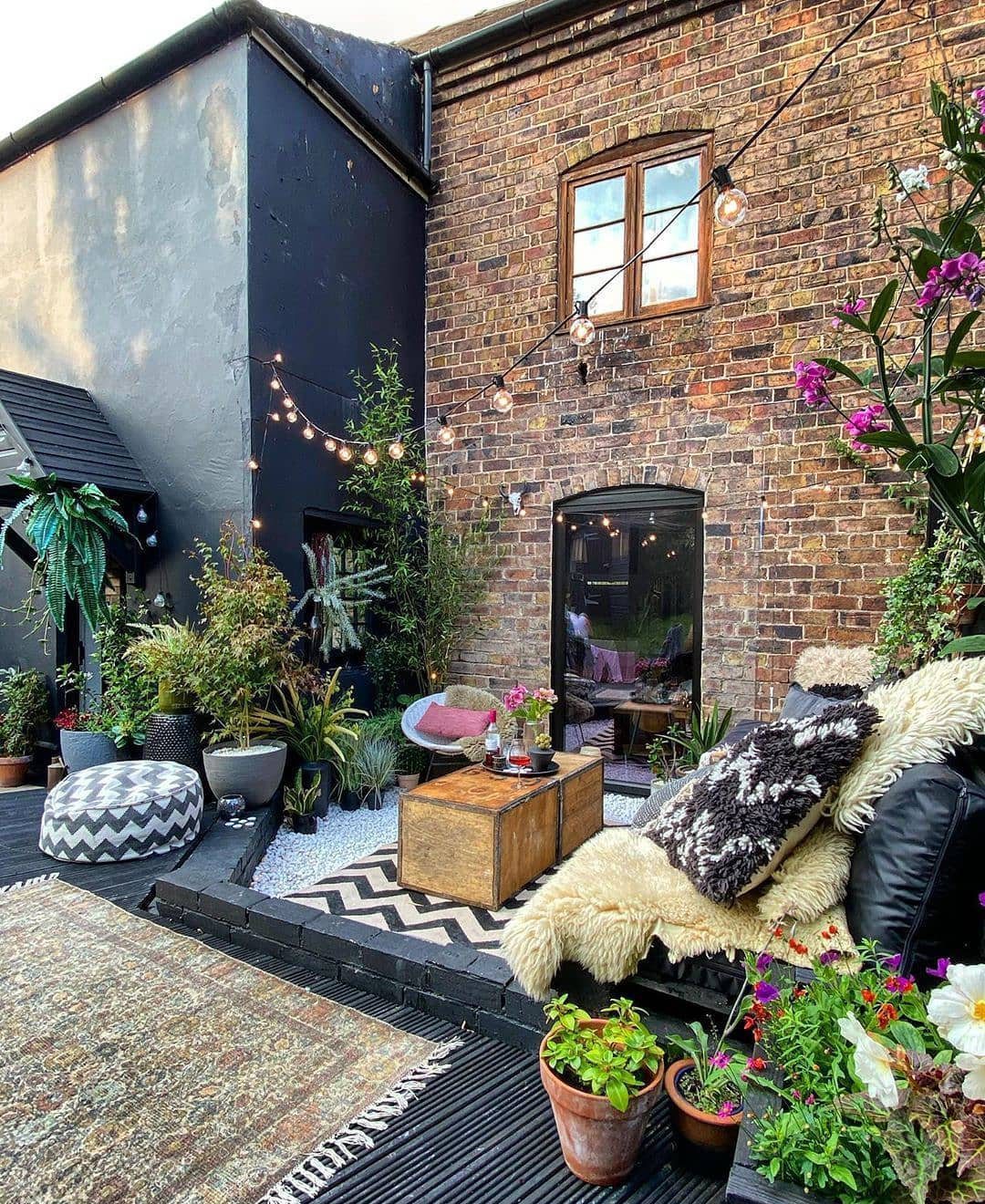 24 Stunning Boho Patio Ideas That Wow in 2025 8 Industrial Charm Meets Bohemian Warmth - Bohemian Patio Decor