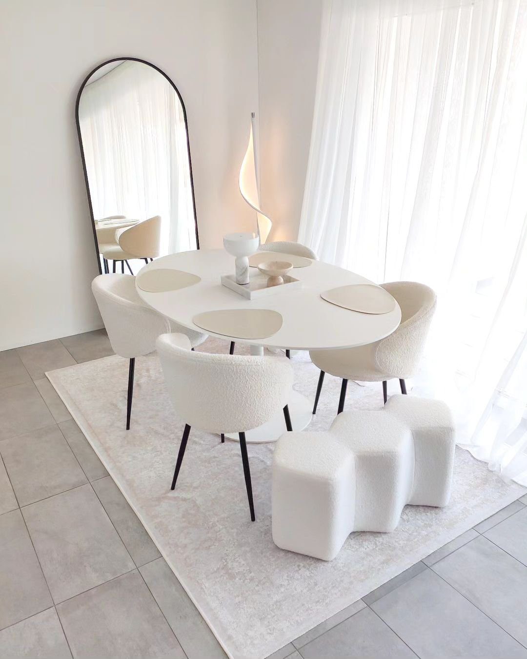 Stunning Mirrors That Transform Dining Rooms in 2025 8  Minimalist Dining Room with Arched Mirror