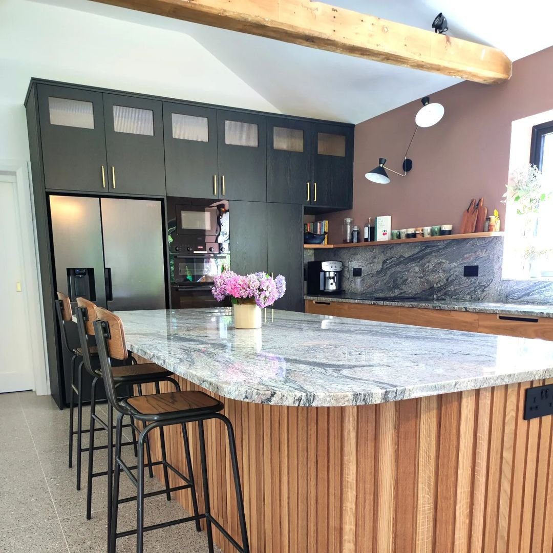 20 Jaw-Dropping Black & Oak Kitchens for 2025 18 Bold Elegance: Marble and Wood Fusion