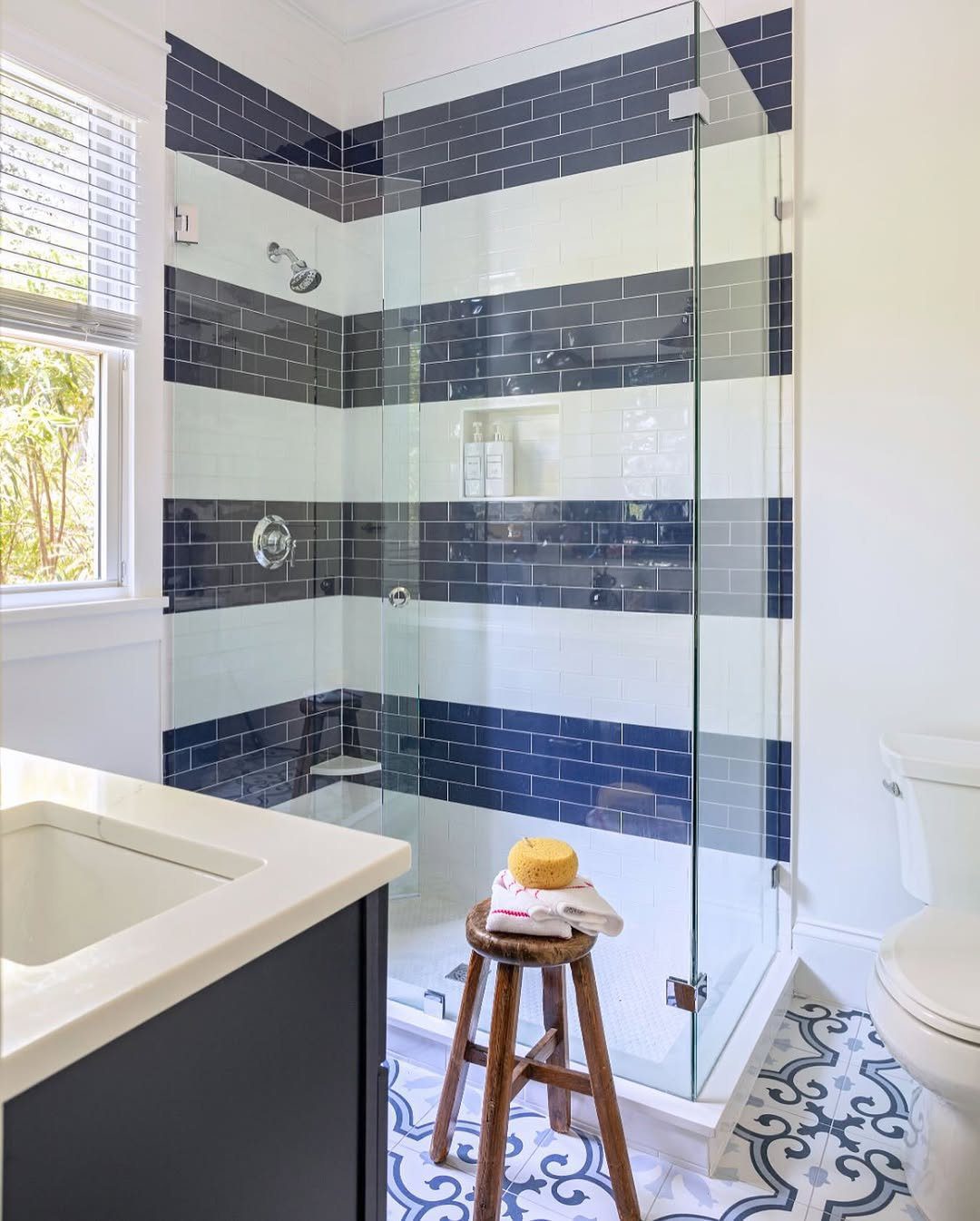 15 Dreamy Nautical Bathroom Trends for 2025 12 Striped Tiles For Coastal Flair