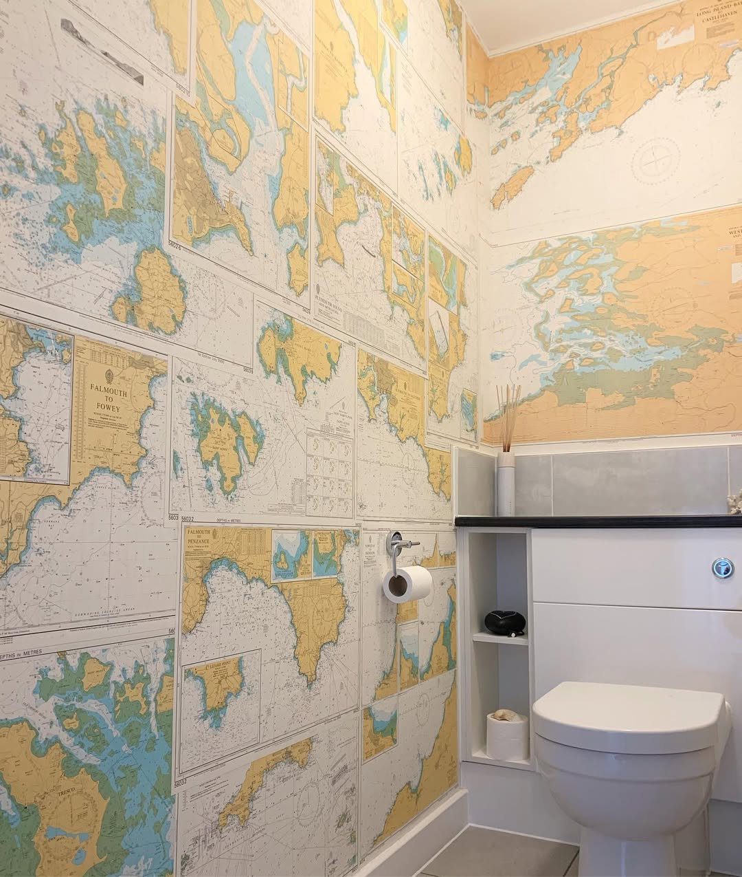 15 Dreamy Nautical Bathroom Trends for 2025 13 Coastal Maps Add Wanderlust Charm