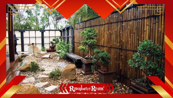 Zen garden patio with a koi pond, stone benches, and bamboo screens