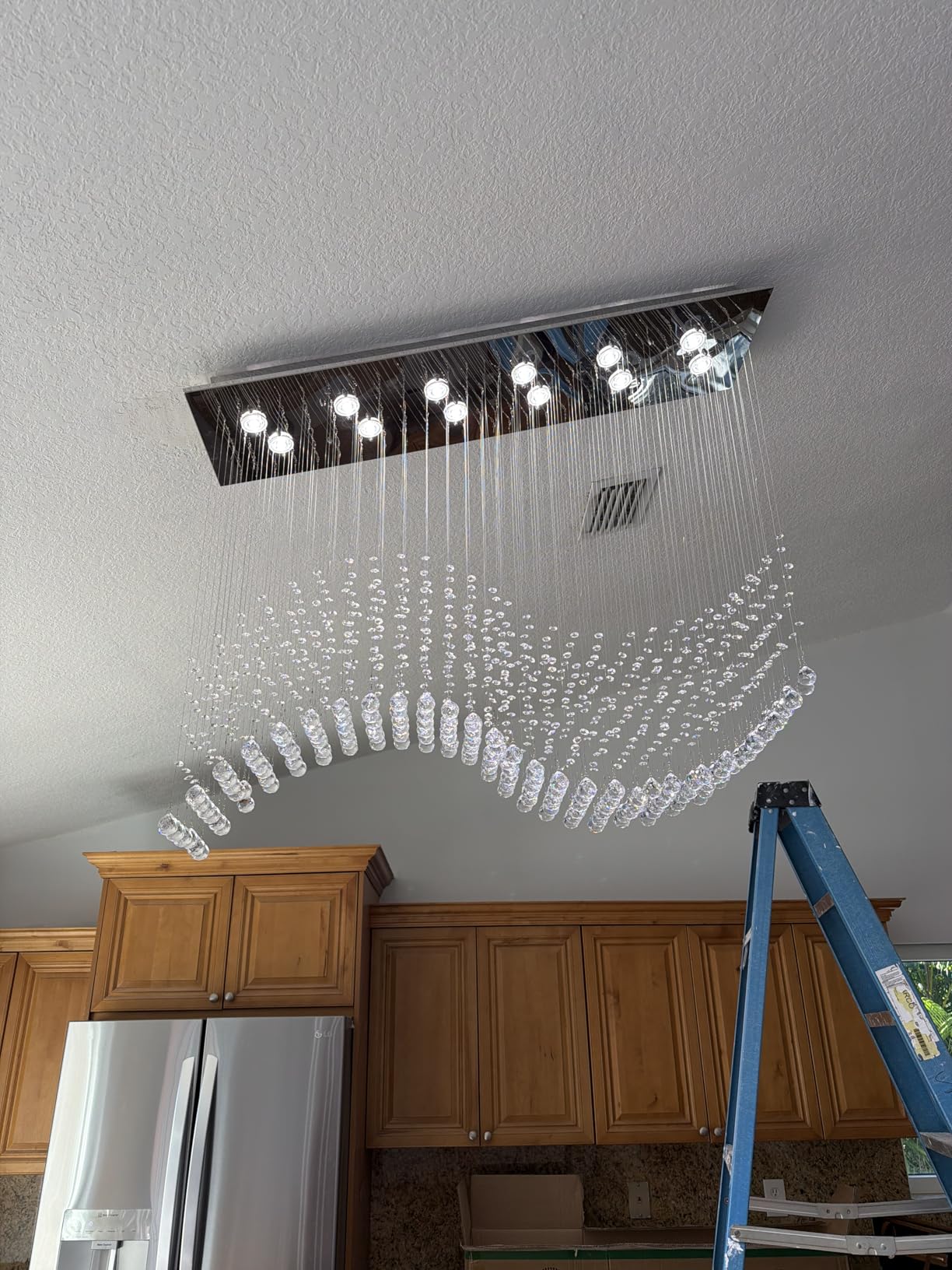 Siljoy Modern Crystal Chandeliers, 12-Light Rectangular K9 Crystal Wave Raindrop Chandelier, Dimmable Rectangle Flush Mount Crystal Ceiling Light for Dining Room Kitchen Island L47 Inch customer photo 1