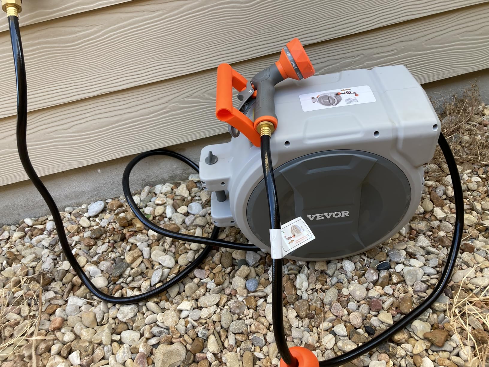 VEVOR Retractable Garden Hose Reel, 1/2 Inch x 65 ft Wall Mounted, Heavy Duty Garden Hose Reel with 9 Patterns Nozzle, Any Length Lock, Upgraded Slow Return System and 180°Swivel Bracket customer photo 1