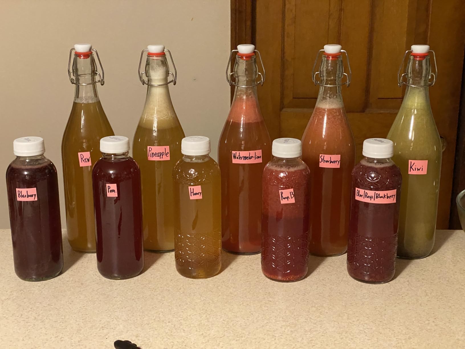 8 Pack [1 L / 33 fl. oz.] Swing Top Glass Bottles w/ Airtight Stopper Lids - Flip Top Brewing Bottle for Fermentation, Kombucha, Mead, Vinegar, Beer, Kefir, Wine, Soda - With 8 Extra Seals & 2 Pourer customer photo 2