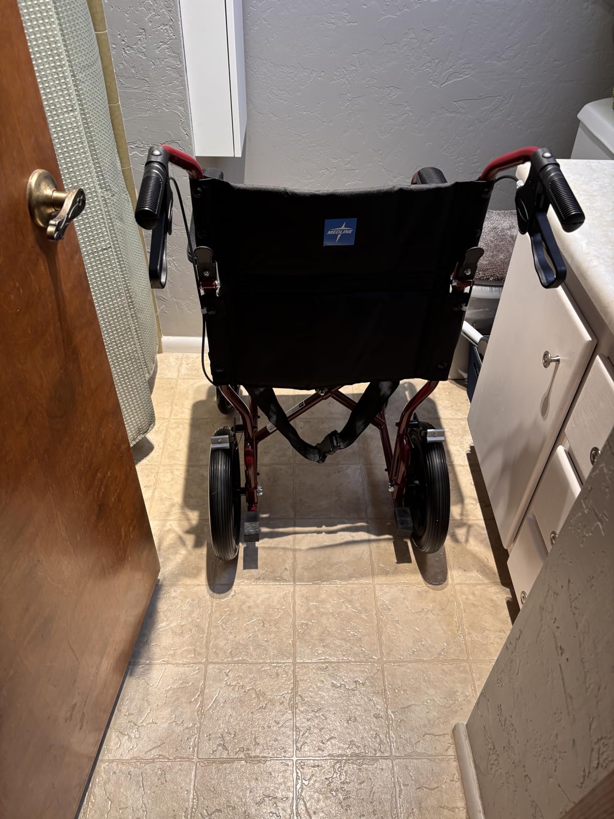 Medline Lightweight Foldable Transport Wheelchair with Handbrakes and 12-Inch Wheels, Red Frame, Black Upholstery customer photo 2