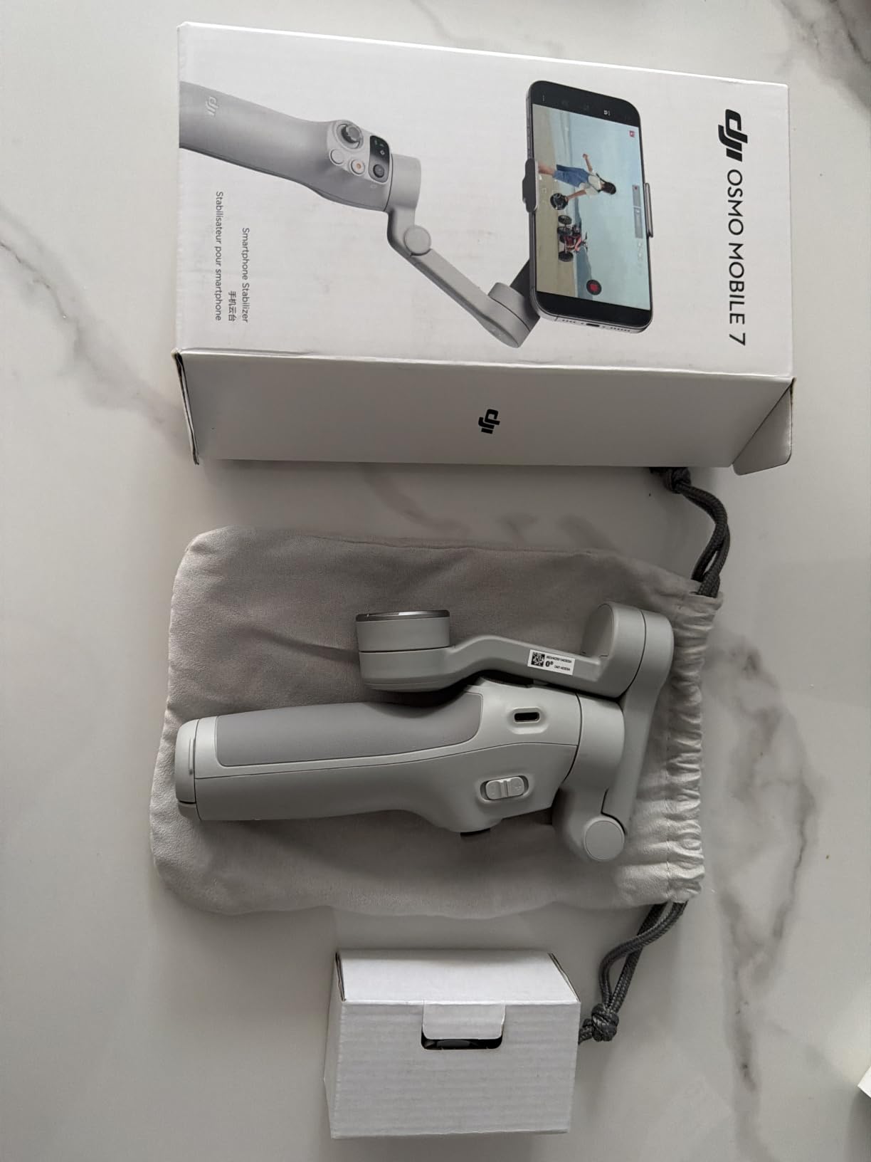 DJI Osmo Mobile 7 Gimbal Stabilizer for iPhone, Android, Built-in Tripod, Portable Stabilizer, 3-Axis Phone Gimbal, ActiveTrack 7.0, One-Tap Edit, 10hrs Use, Phone Charging customer photo 1