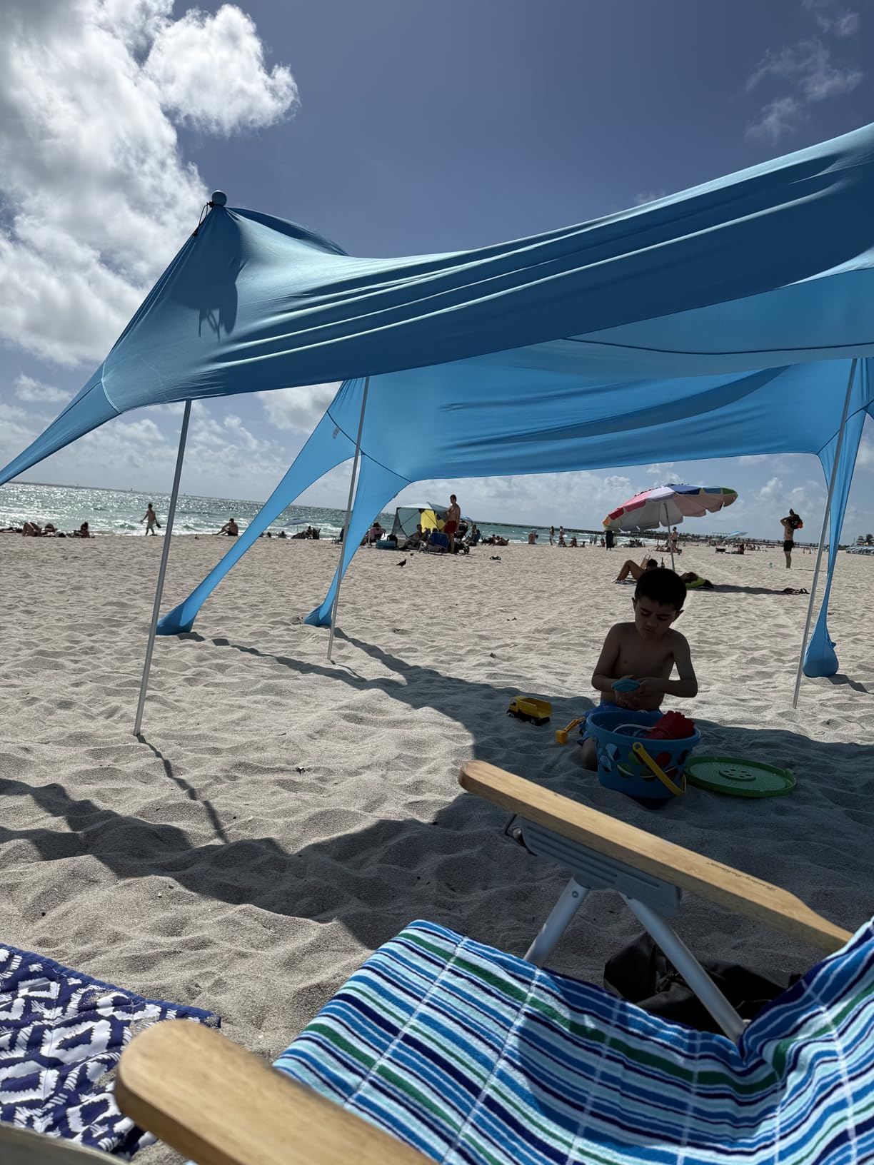Rhino Valley Beach Tent, 10 x 10 FT Beach Shade UPF50+ Protection, Beach Canopy with 8 Sandbags 4 Stability Poles, Outdoor Beach Tent Sun Shelter Umbrella for Sand, Camping, Fishing Essentials, Sky Blue customer photo 1