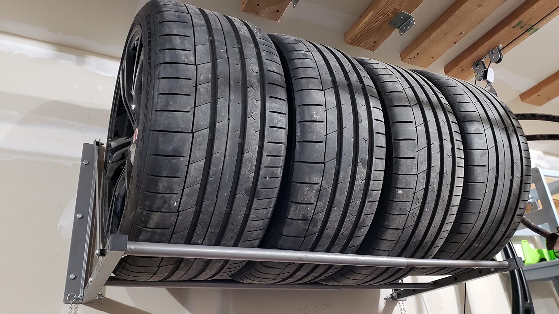 MaxxHaul Adjustable Wall Mount Folding Tire Rack - 32 to 48 Inch Width - 300 lb Capacity - Heavy Duty Steel Garage Tire Storage Holds 4 Tires - 70489 customer photo 2