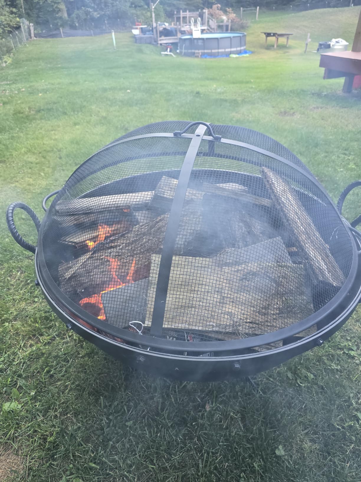 Ash & Ember 32in Hemisphere Fire Pit with Screen and Poker, Cast Iron High-Temperature Black Paint Fire Bowl, Wood Burning Backyard Fireplace, Portable Outdoor Firepit customer photo 1