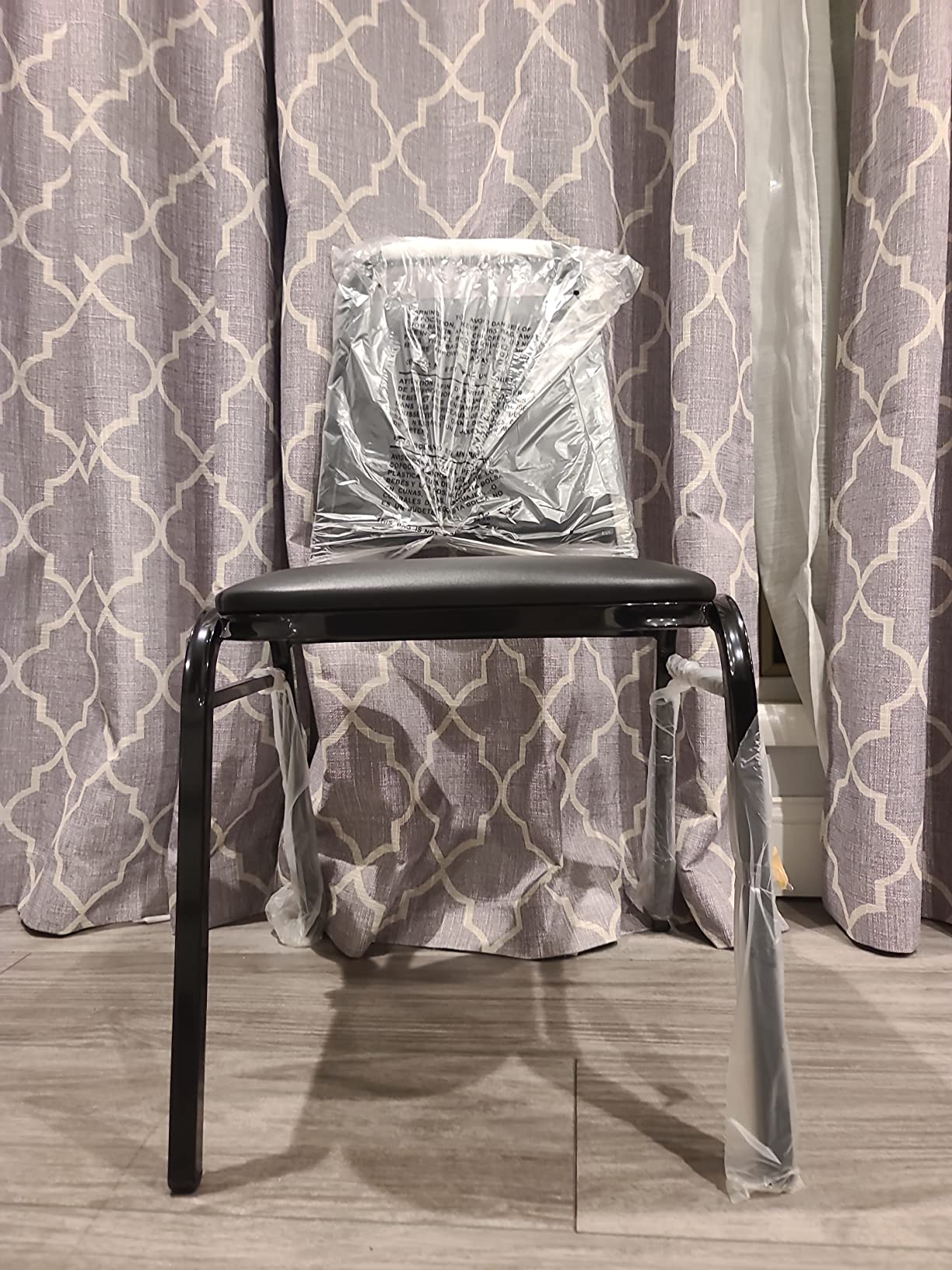 EMMA + OLIVER Trapezoidal Back Vinyl Stackable Banquet Chair, Multipurpose Stacking Chair with Padded Seat and Back, Black customer photo 1