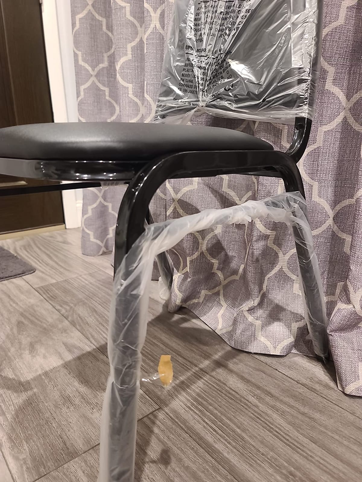 EMMA + OLIVER Trapezoidal Back Vinyl Stackable Banquet Chair, Multipurpose Stacking Chair with Padded Seat and Back, Black customer photo 2