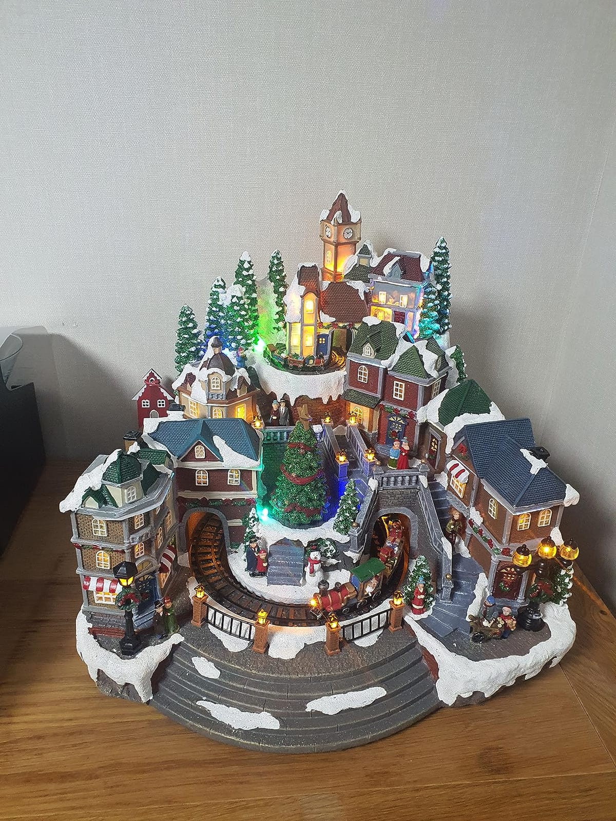 MOMENTS IN TIME Animated Christmas Village Scene with Rotating Train LED Lighted Houses Snow Covered Town Display Holiday Tabletop Decor with Christmas Tree and Figurines customer photo 1