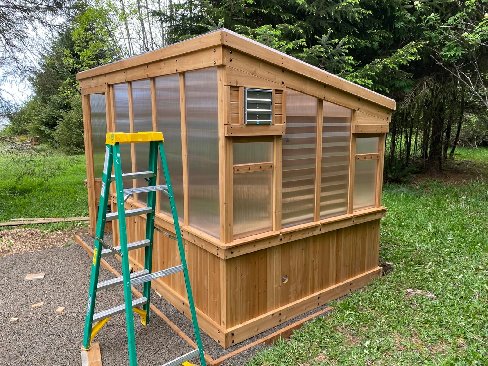 Backyard Discovery Willow 9' x 6' White Cedar Wood and Polycarbonate Walk-in Greenhouse Kit with Exhaust Fan, Windows, Hose Hook-Ups, PowerPort, Staging Shelves for Year-Round Outdoor Gardening customer photo 1