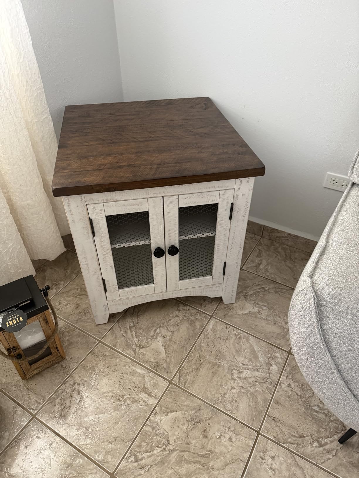 Signature Design by Ashley Wystfield End Table with Storage, White/Brown | Distressed vintage white and natural pine finish, Double metal grill doors, Farmhouse style storage customer photo 1